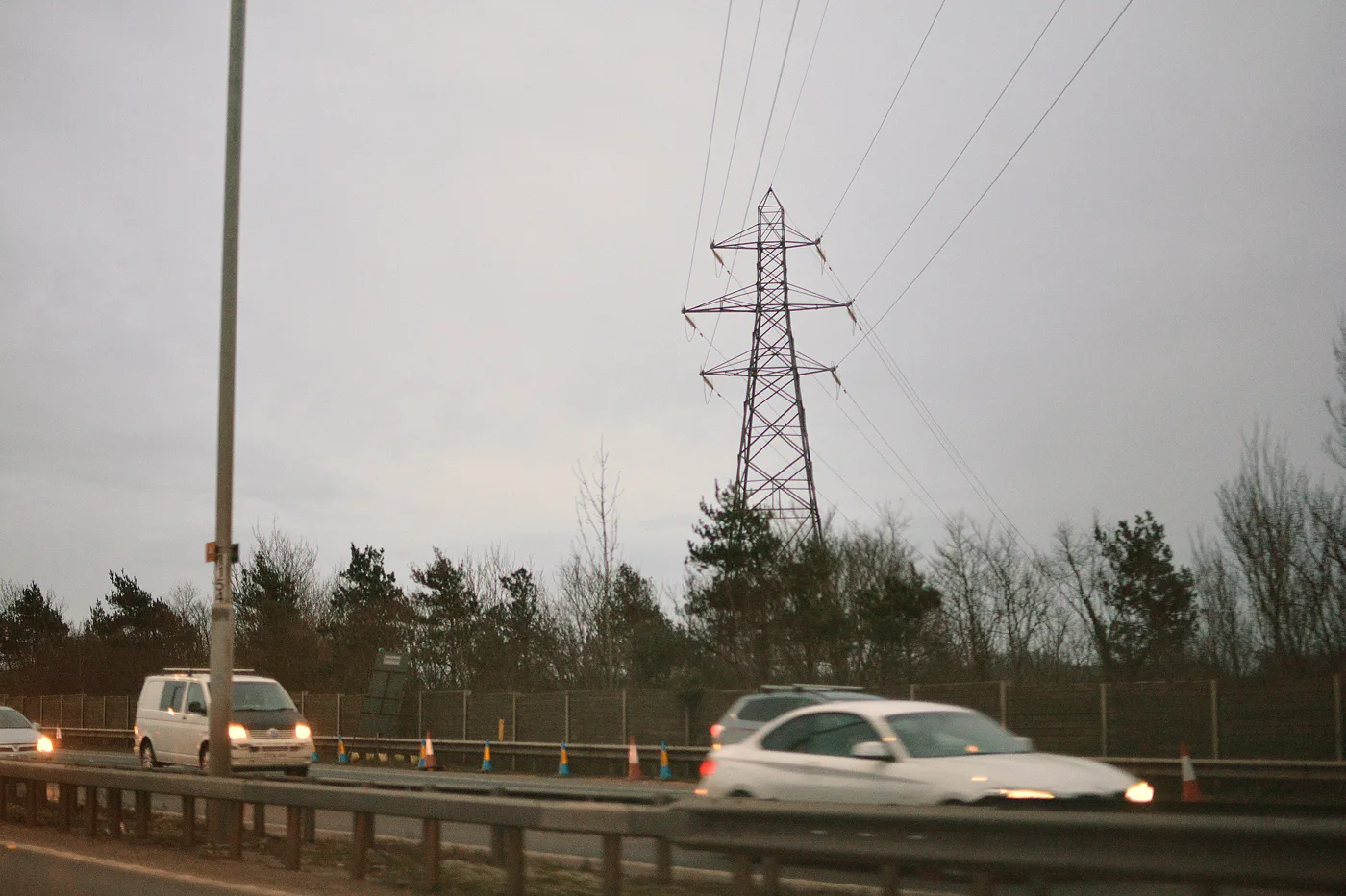Power lines cross the M4 in the Borough of Wokingham. The photo does not show the tower being rebuilt at Winnersh.