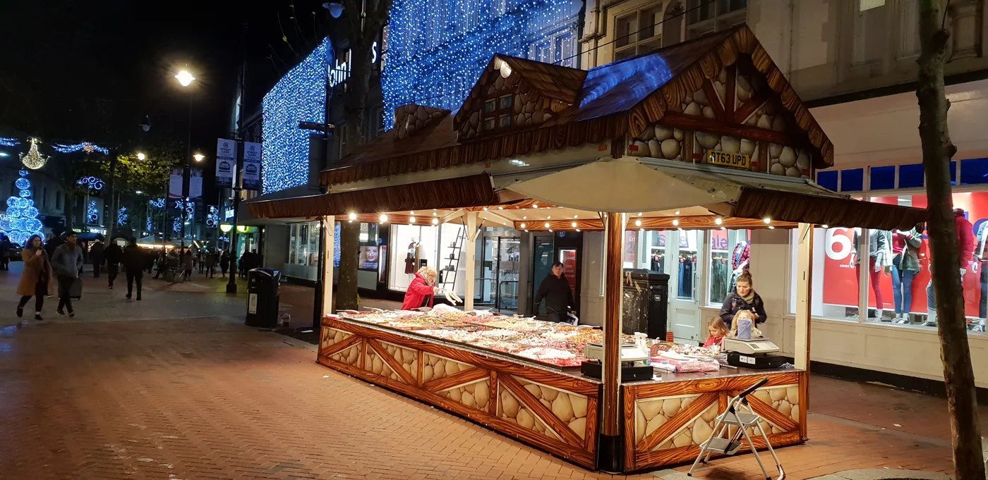 A Christmas market chalet on Broad Street, Reading, under the town centre lights