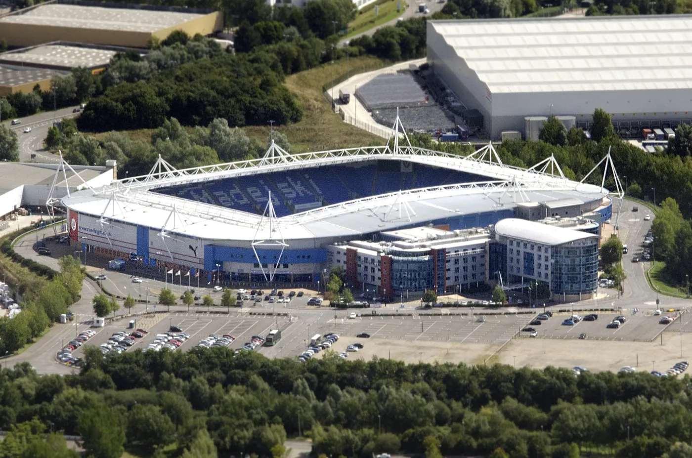 The stadium and the surface car parks around it, photographed in 2014. The parking area is the Royal Elm Park site, a landfill capped in 1985